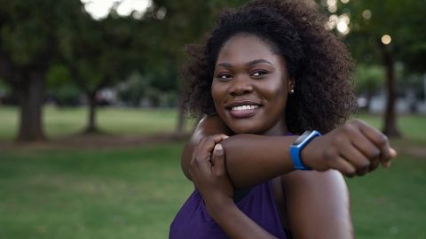 Type 2 diabetes: woman holding out her arm and smiling.