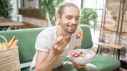 A man eating a salad.